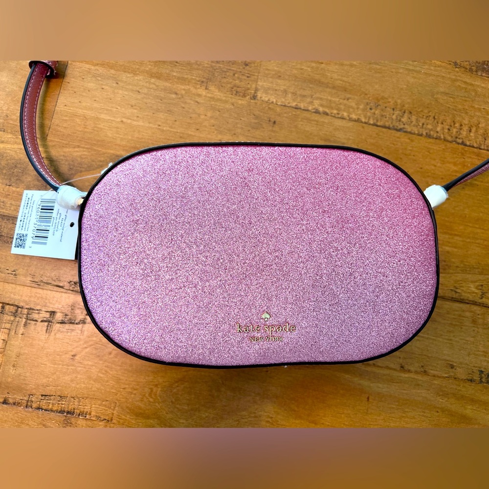 Kate spade Glimmer oval camera bag in Mitten Pink